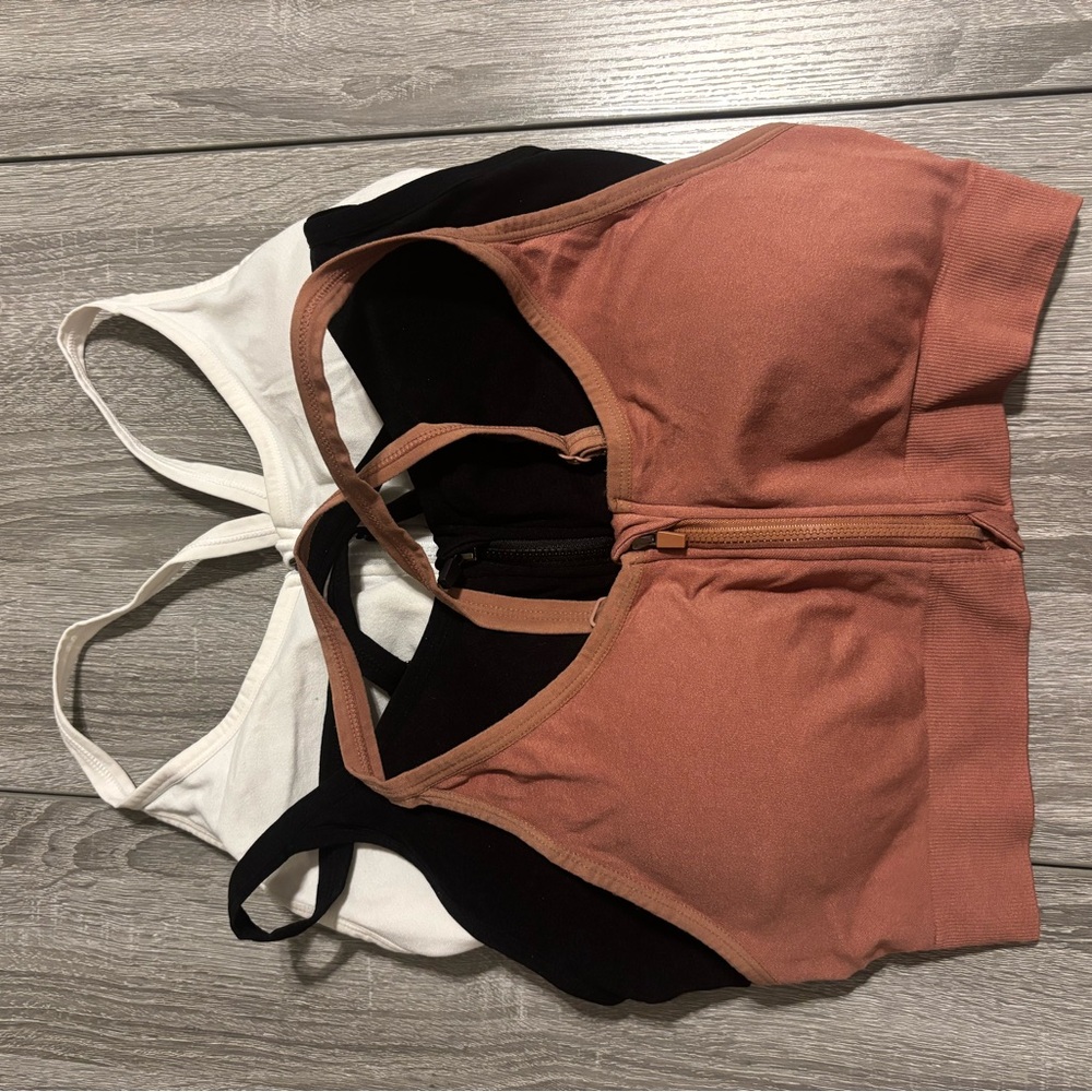 Set of Three Sports Bras in Black, White, and Pink